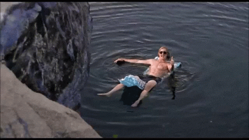 Man Laying on Raft Summertime