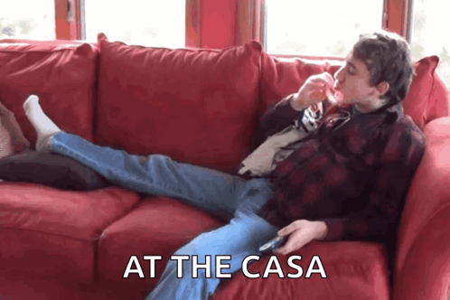 Man Laying On Red Couch At The Casa GIF
