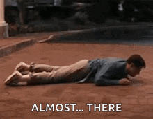 Man Laying on Stomach Saying Almost There