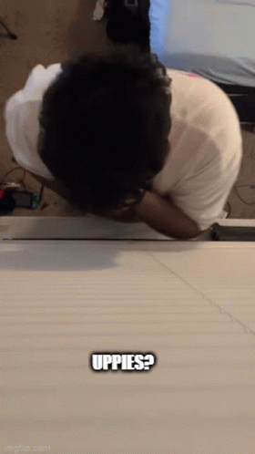 Man Laying On Table Saying Uppes GIF