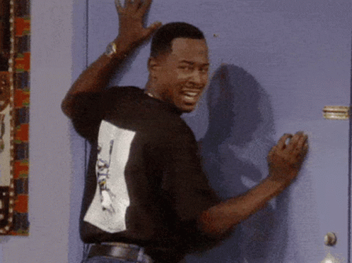 Man Leaning Against Door