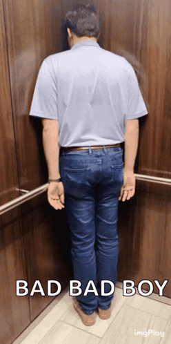 Man Leaning Against Wall in Elevator