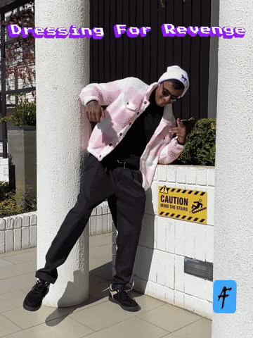 Man Leaning Against Wall With Caution Sign