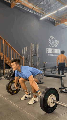 Man Lifting Barbell at Fullsterker Sign