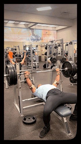 Man Lifting Barbell in Gym
