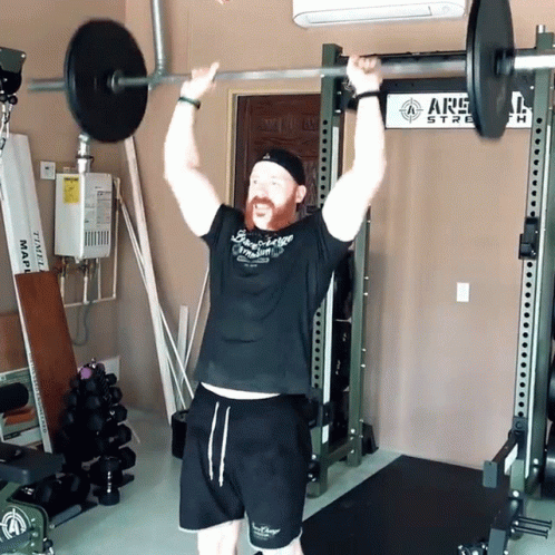Man Lifting Barbell Near ARS Sign GIF