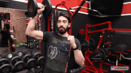 Man Lifting Dumbbell In Black Apocalypse Shirt GIF