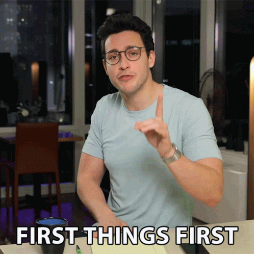 Man Light Blue Shirt Glasses Saying First Things First
