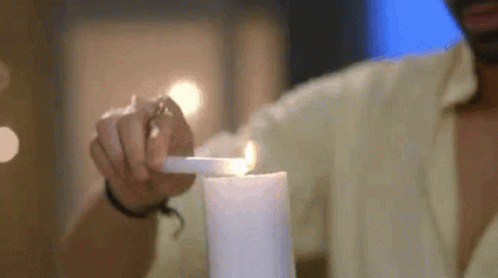 Man Lighting Bougie In A Date GIF