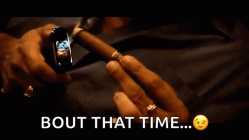 Man Lighting Cigar With Bout That Time
