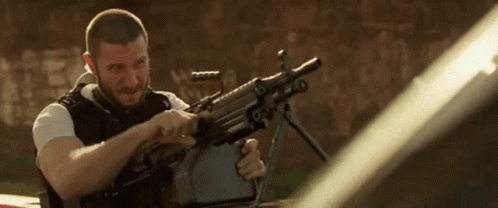 Man Loading Machine Gun GIF