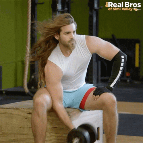 Man Long Hair Lifting Dumbbell Real Bros Logo GIF