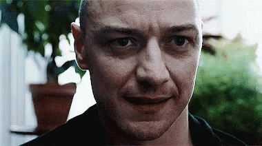 Man Looking at Camera with Plant