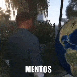 Man Looking at Globe With Mentos