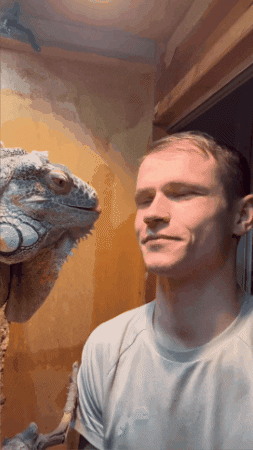 Man Looking at Lizard on Shoulder
