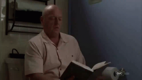 Man Looking at Paper With Eyes Closed