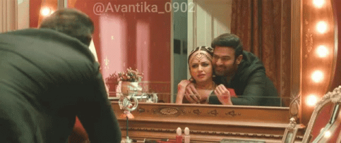 Man Looking At Woman In Mirror GIF