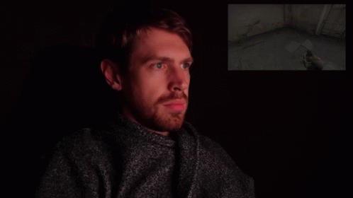 Man Looking Away After Flashbang GIF