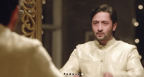Man Looking in Mirror With Name Tanuja