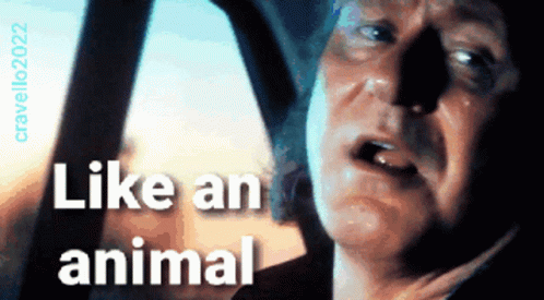 Man Looking Out Car Window Like an Animal
