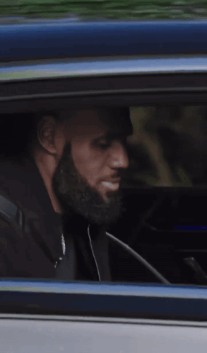 Man Looking Out Car Window While Driving GIF