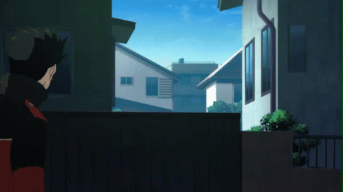 Man Looking Out Window At Cityscape GIF