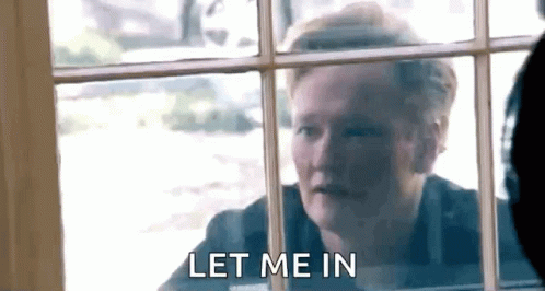 Man Looking Out Window Saying Let Me In