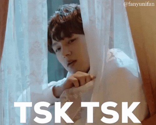 Man Looking Out Window Saying Tsk Tsk