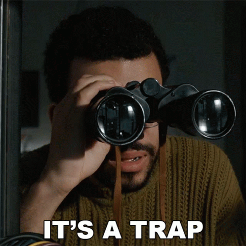 Man Looking Through Binoculars Saying It's a Trap