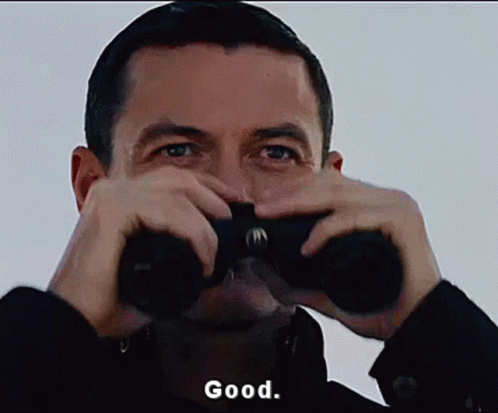 Man Looking Through Binoculars