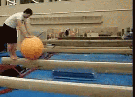 Man Loses Balance On Big Ball GIF