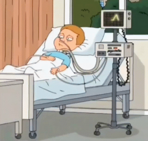 Man Lying in Hospital Bed