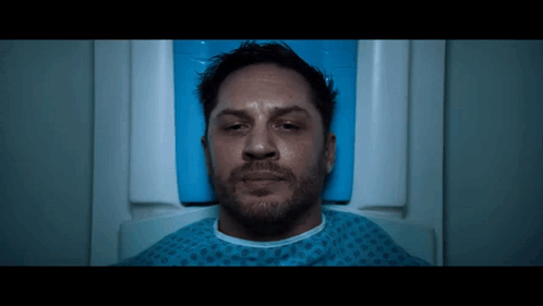 Man Lying in Hospital Bed