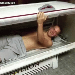 Man Lying in Invision Tanning Bed