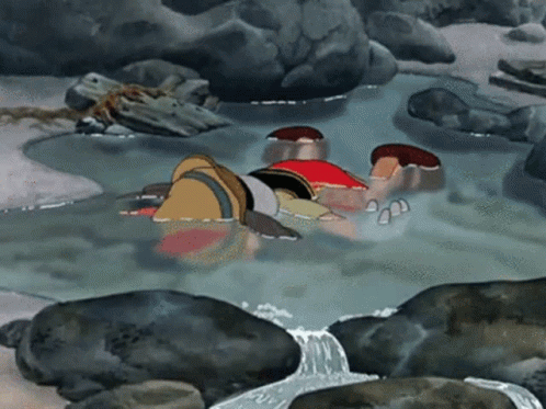 Man Lying in Water Stream