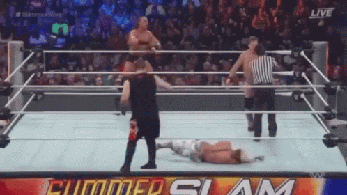 Man Lying In Wrestling Ring Referee Watching GIF