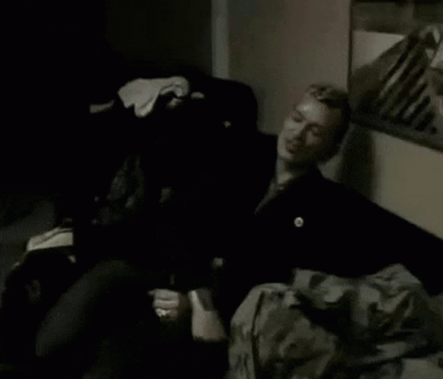 Man Lying On Bed In Dark Room GIF