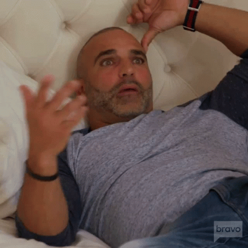 Man Lying on Bed with Bravo