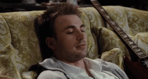 Man Lying on Couch Eyes Closed
