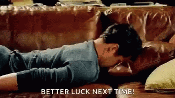 Man Lying on Couch Saying Better Luck Next Time