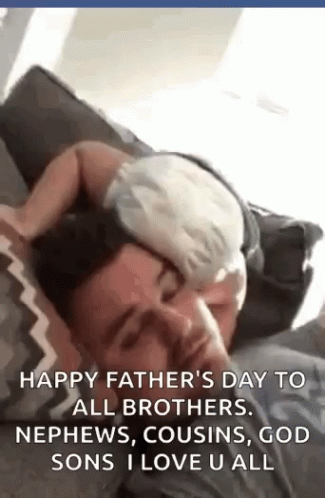 Man Lying on Couch with Baby on Head