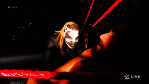 Man Lying on Ground Behind Monster