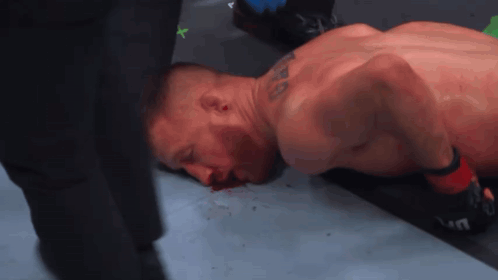 Man Lying on Ground Bleeding from Mouth