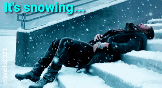 Man Lying on Snowy Stairs Saying Its Snowing
