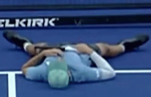 Man Lying On Tennis Court GIF