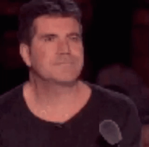 Man Making Face at Microphone
