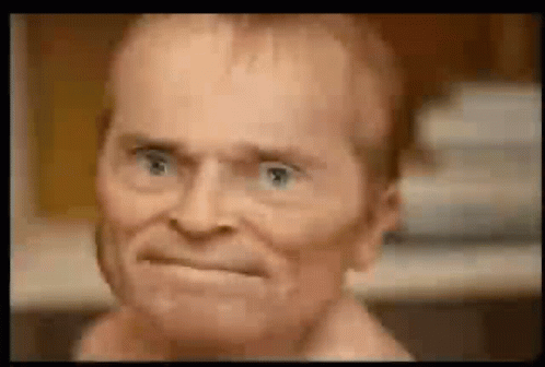 Man Making Face with Blue Eyes