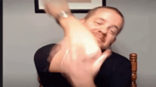 Man Making Funny Face and Raising Hand