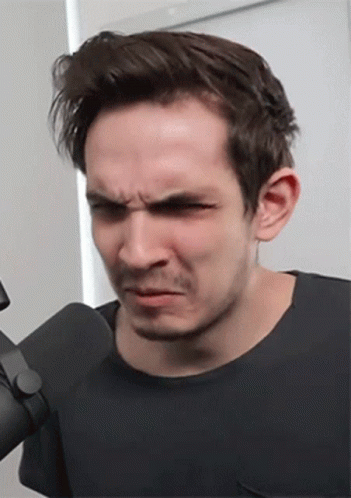 Man Making Funny Face at Microphone