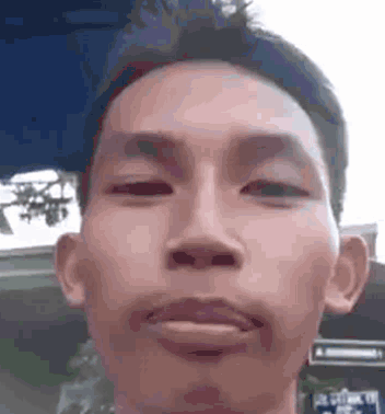 Man Making Funny Face Eyes Closed